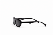 Black sunglasses with dark lenses on a white background