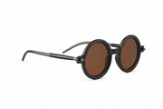 Minimalist round sunglasses with a matte black frame and warm brown lense
